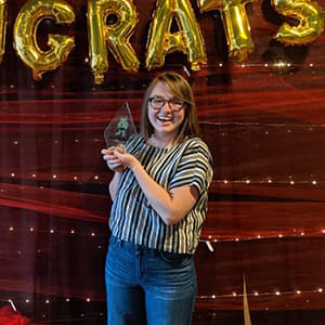 Amanda Blackman holding an award plaque