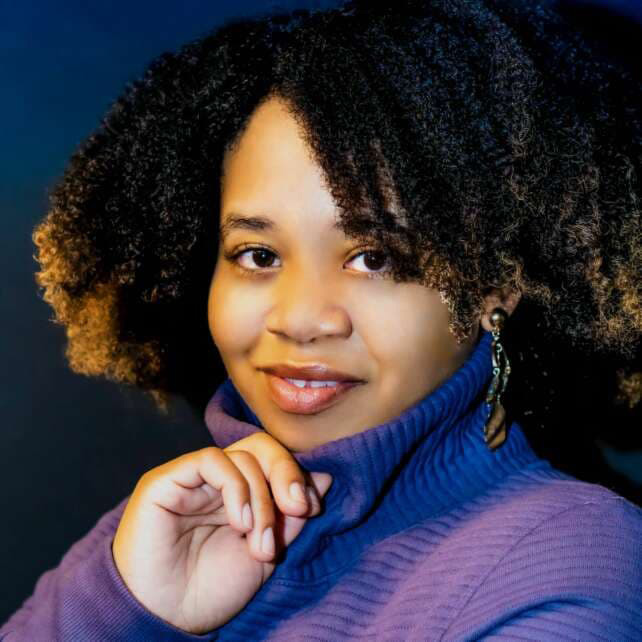 Headshot of Shameka McBoat in a purple sweater.