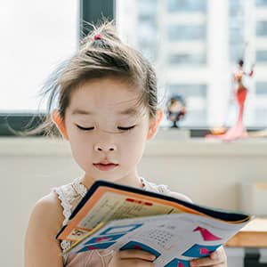 Young girl reading a book