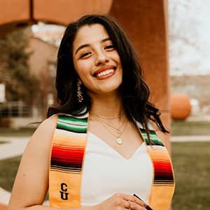 Odalis Castro smiling with a CU Denver stole