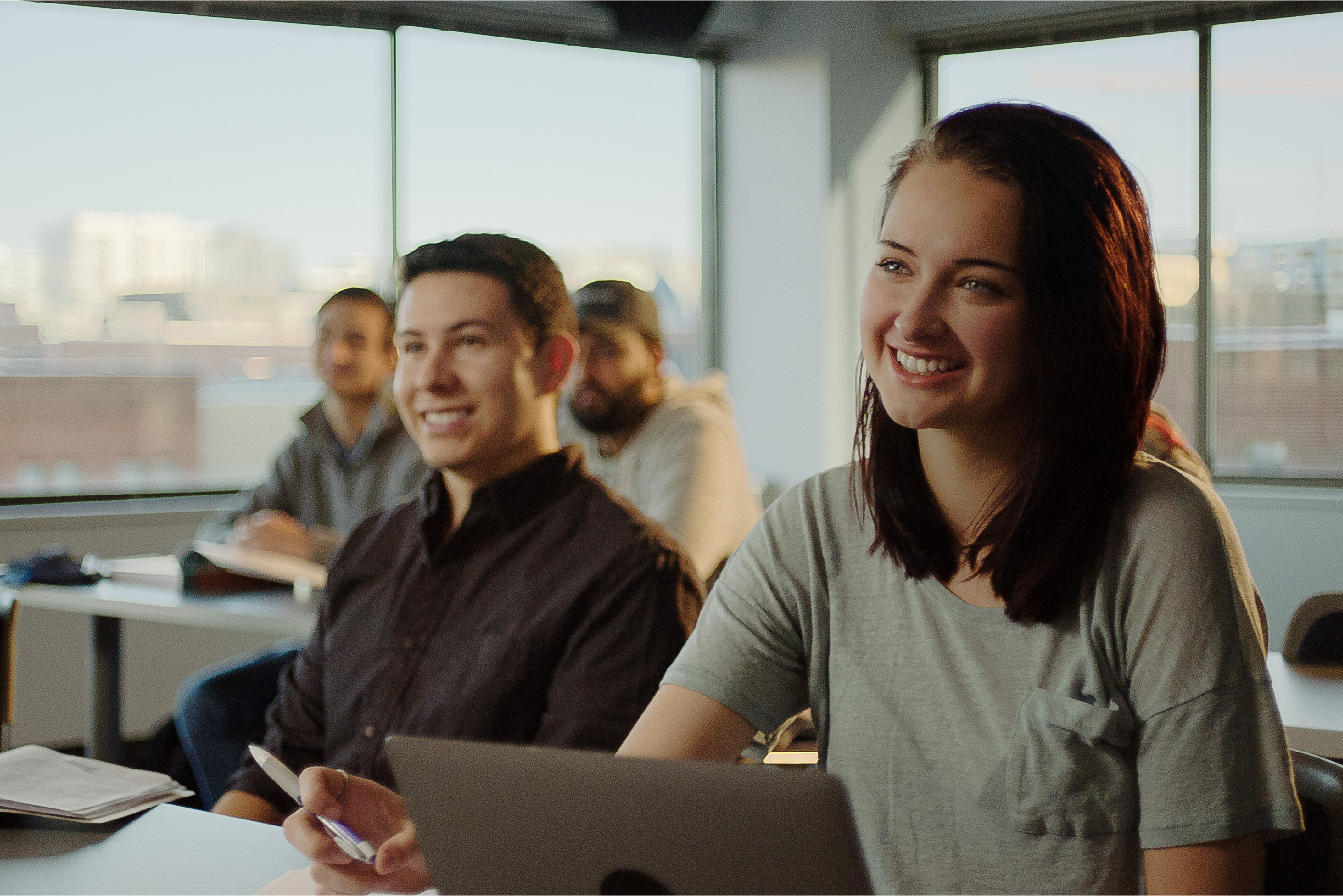 Two smiling students in class