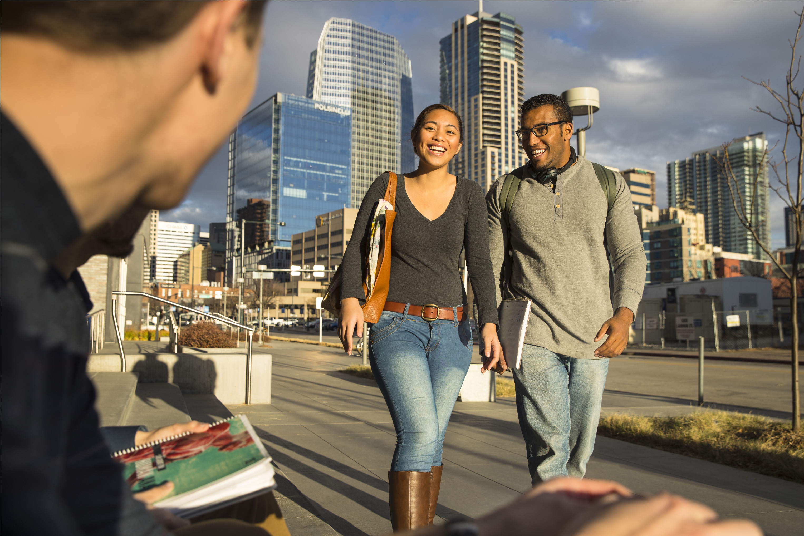 A few studentsd walking through the CU Denver campus