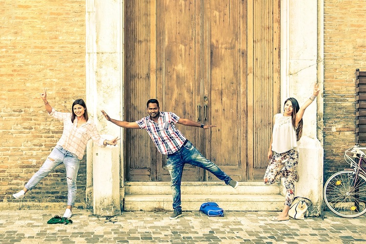 CU Denver students posing in front of a villa door