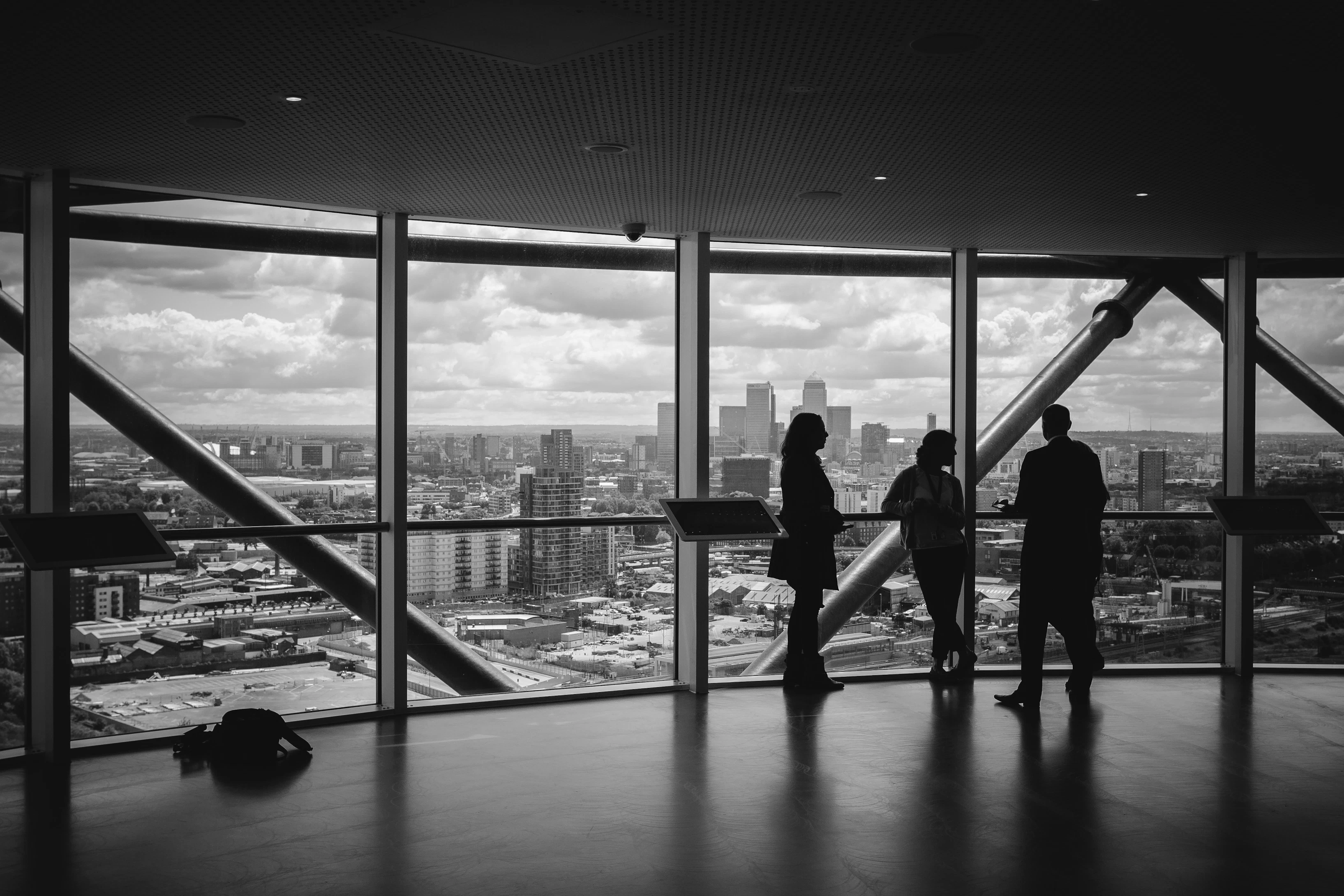 Image of people looking outside of a building