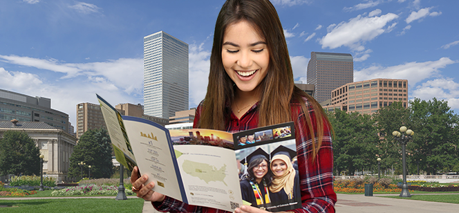 Anna Luiza looking at a school brochure