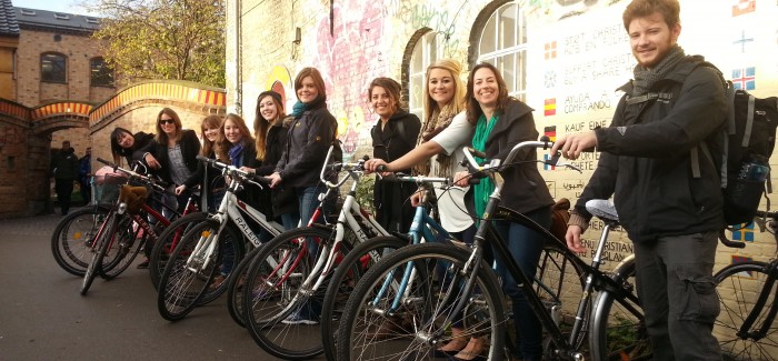 students posing on bicycles in Berlin