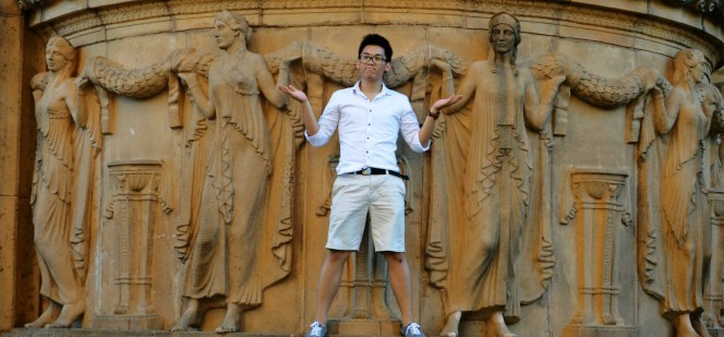 Daniel Edgarth posing in front of stone relief sculpture Daniel Edgarth posing in front of stone relief sculpture
