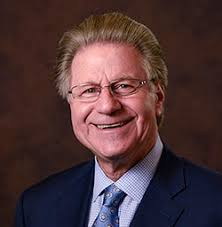 Headshot of Ronald Sokol smiling in business suit