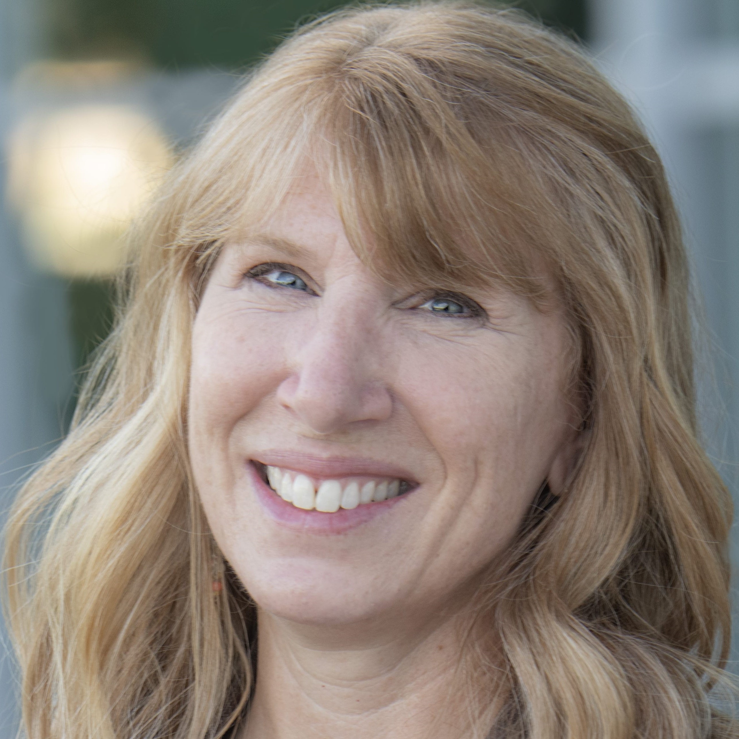 Close-up headshot of Christina Perkins smiling