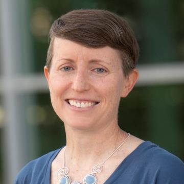 Headshot of Christa LeGray from the shoulders up smiling