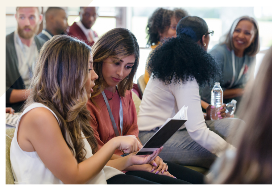 People at a conference talking with one another